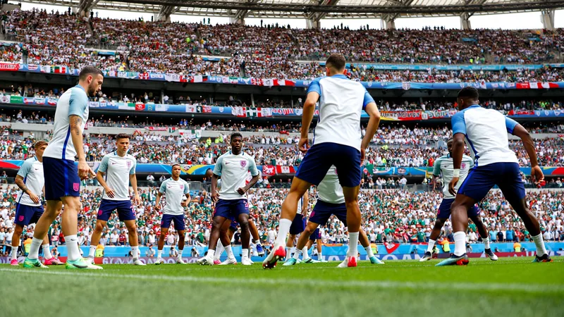 England faces history and hostile crowd in Mexico World Cup clash England players training at the Azteca Stadium with a packed crowd in the background, preparing for their World Cup match against Mexico.