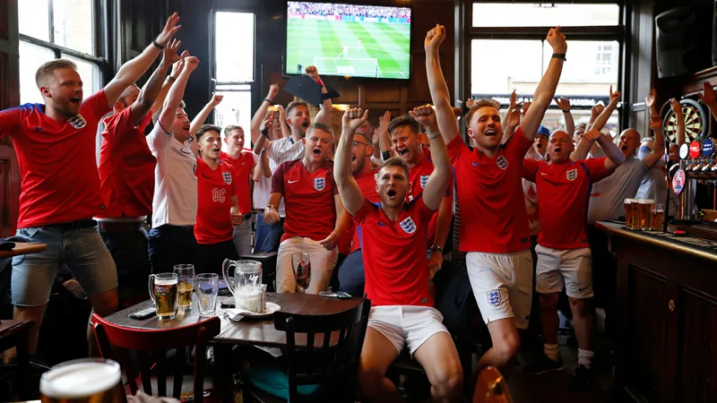 England fans celebrate Kane's penalty — latest news and analysis England fans cheering at a pub in Reading after Harry Kane's winning penalty
