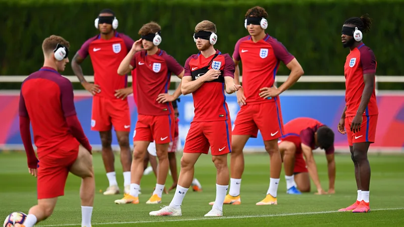 England take precautions against noisy Mexico fans, altitude England football team in training, with players wearing ear plugs and sleep bands, preparing for World Cup match against Mexico.