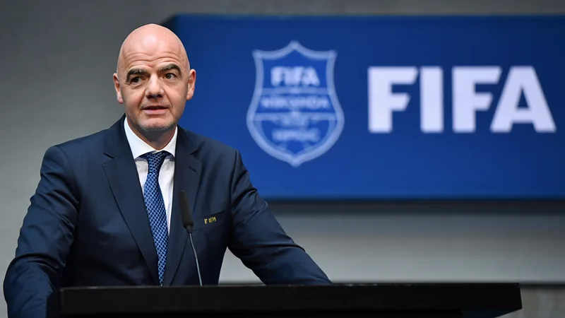 FIFA to assess 64-team World Cup proposal after 2026 Gianni Infantino speaking at a podium with FIFA logo in background, addressing World Cup expansion plans. — latest news and analysis.