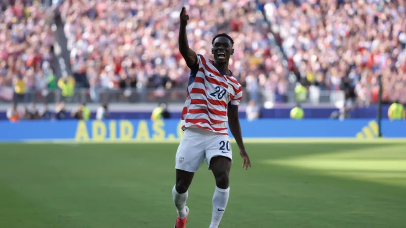 USA striker Folarin Balogun celebrates a goal during a World Cup match, with teammates around him. — latest news and analysis.