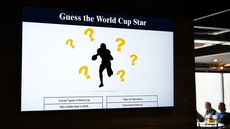 Football Quiz: Guess the World Cup Star – Day 26 A football quiz interface showing a silhouette of a player with question marks and clue boxes, inviting users to guess the World Cup star.