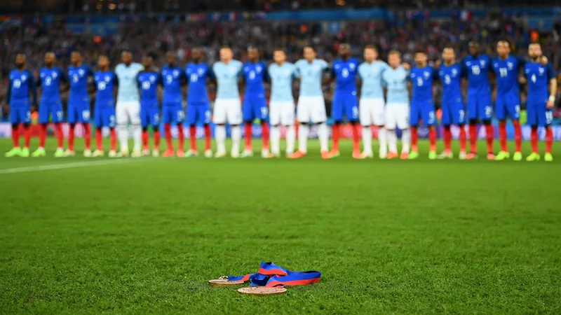 England and France players line up before a World Cup match, with a bronze medal in the foreground. — latest news and analysis.