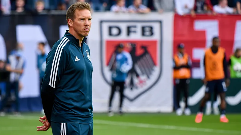 Germany seeks Klopp talks after Nagelsmann resigns Julian Nagelsmann looks on during a Germany match; DFB logo in background.