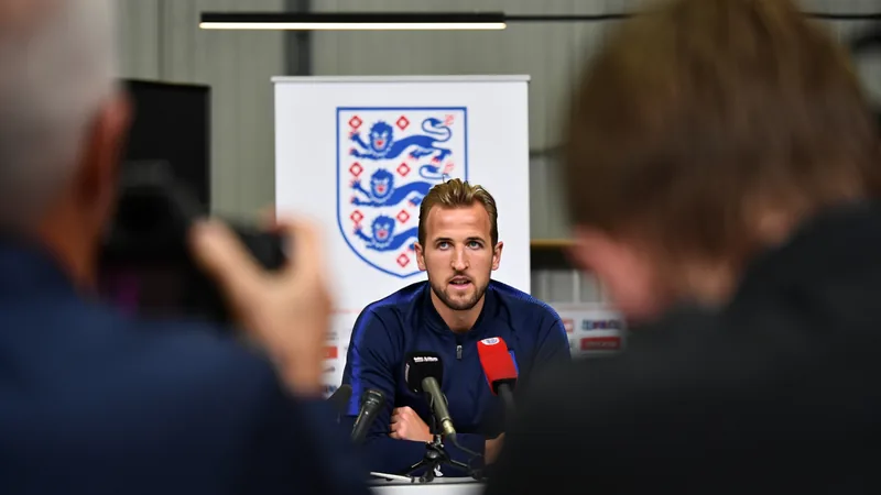 Kane backs Tuchel criticism, says England have another level England captain Harry Kane speaks during a press conference, with a backdrop of the England team logo. — latest news and analysis.