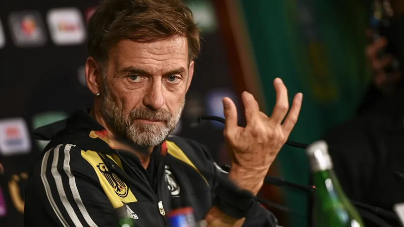 Klopp: 'The day you don't want me anymore, I'm gone' Jürgen Klopp speaking at a press conference, wearing a Germany tracksuit, with a serious expression. — latest news and analysis.