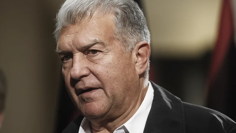 Joan Laporta speaking at a press conference about Barcelona transfer plans