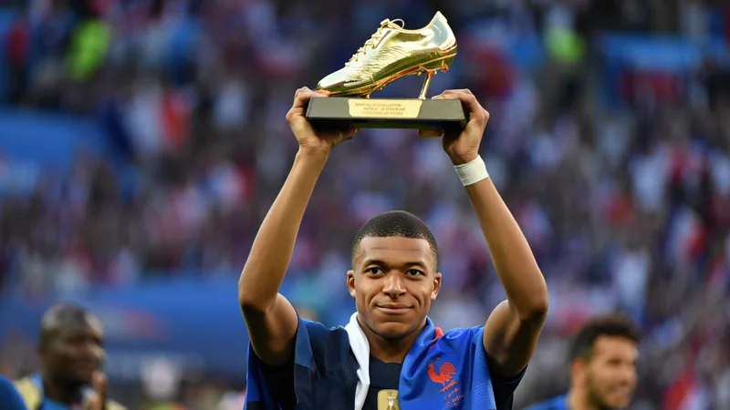 Mbappe wins 2026 World Cup Golden Boot, first to win twice Kylian Mbappe holding the Golden Boot award at the 2026 World Cup, celebrating his second consecutive top scorer honor. — latest news and analysis.