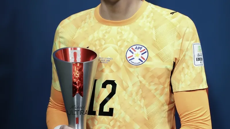 Orlando Gill holding a Man of the Match award after Paraguay-France match