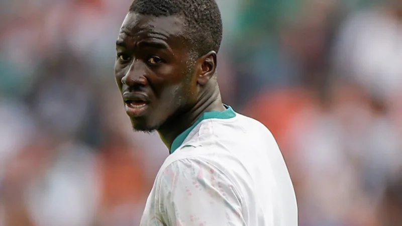Pape Gueye in Senegal national team kit, looking serious