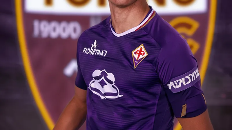 Pietro Comuzzo in action for Fiorentina, with Torino logo in background