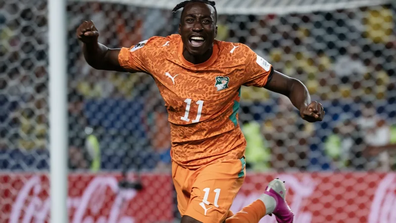 A football transfer news graphic showing PSG and Real Madrid logos with Yan Diomande's name. — latest news and analysis.