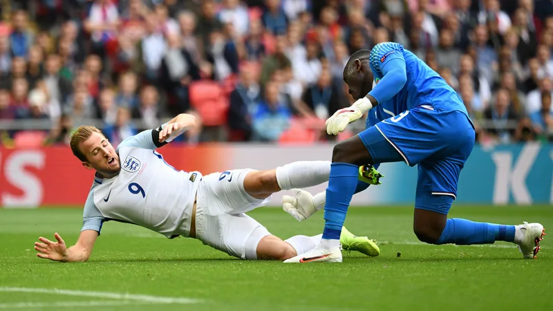 Pundits split on Kane penalty claim — latest news and analysis Harry Kane goes down under a challenge from DR Congo goalkeeper Lionel Mpasi-Nzau during a match. — latest news and analysis.