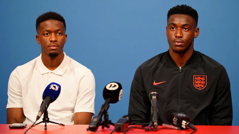 Morgan Rogers and Djed Spence at an England news conference