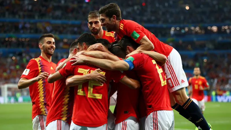 Spain players celebrate after a goal during the World Cup semi-final against France, showing their team spirit and collective identity.