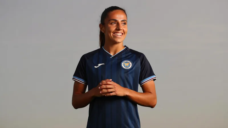 Daniela Arques in a London City Lionesses kit, smiling during a signing announcement photo.