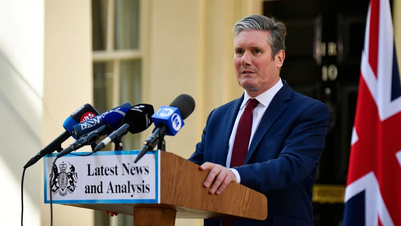 Prime Minister Keir Starmer speaking at a podium, hinting at a bank holiday if England win the World Cup. — latest news and analysis.