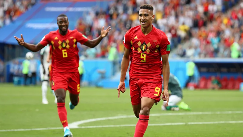 Belgium players Leandro Trossard and Youri Tielemans on the field after scoring a goal against Senegal — latest news and analysis.
