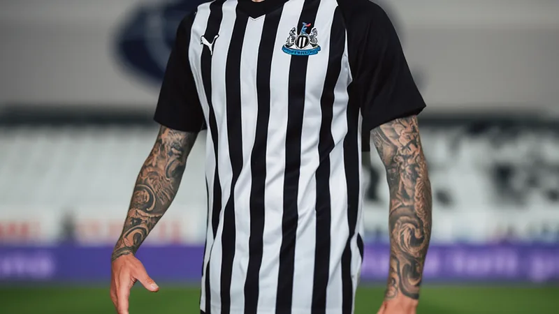 Sandro Tonali in action for Newcastle United, with Tottenham Hotspur logo in background