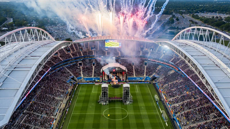 Trump, Bieber, Shakira: 2026 World Cup Final Spectacle Aerial view of New York New Jersey Stadium during the 2026 World Cup final, with fireworks and a halftime concert stage visible on the pitch.