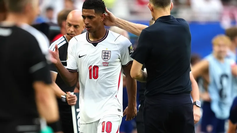 Jude Bellingham and Thomas Tuchel in conversation on the sidelines during an England training session. — latest news and analysis.