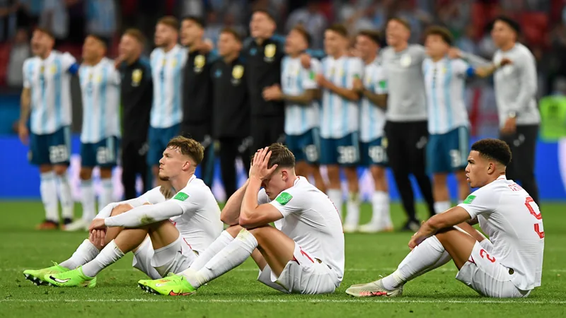 Tuchel's defensive tactics cost England World Cup final spot England players look dejected after losing 2-1 to Argentina in the World Cup semi-final, with Argentina players celebrating in the background.