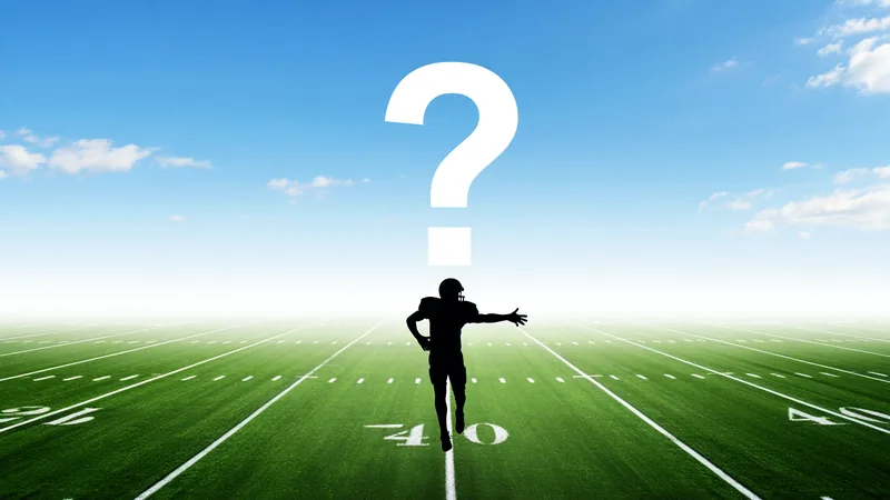 Who Am I? Guess the World Cup Star – Day 30 A football field with a silhouette of a player and a question mark, representing the 'Who Am I?' quiz game. — latest news and analysis.