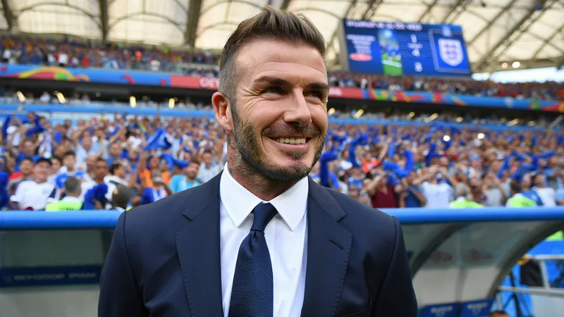 Why David Beckham Became the Face of the World Cup in the US David Beckham smiling in a suit at a World Cup match, with fans in the background and a stadium setting. — latest news and analysis.