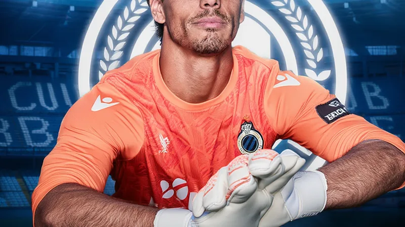 Yann Sommer in goalkeeper kit, poised to make a save, with Club Brugge logo in background
