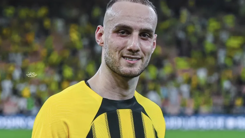 Mario Mitaj Joins Genoa from Al Ittihad — latest news and analysis Mario Mitaj in action during a football match, representing his team.