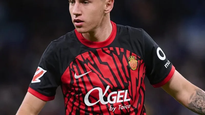 Atlético Madrid and Mallorca logos with a football, symbolizing the transfer agreement for Marc Domenech. — latest news and analysis.