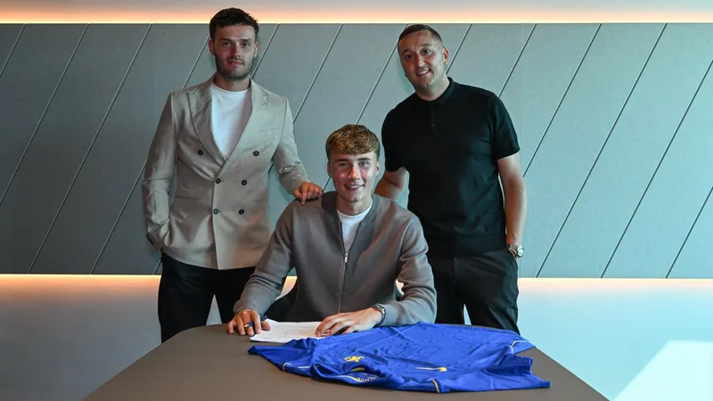 Chelsea Sign Scotland U19 Defender Alfie Osborn Alfie Osborn signing a contract at Chelsea with his agents from CAA Base