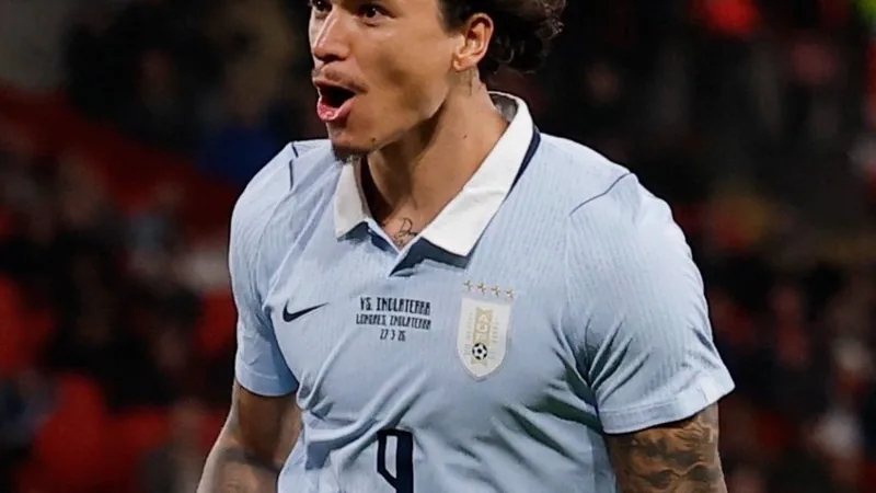 Darwin Núñez in action on the football pitch, wearing a team jersey.
