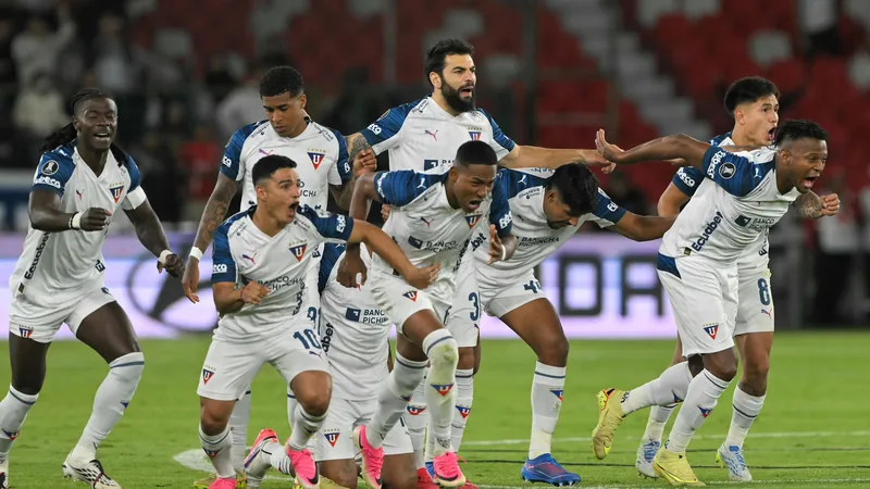 Copa Libertadores: Fluminense, Platense, LDU Advance on Penalties Goalkeeper diving to save a penalty during a Copa Libertadores shootout, with players watching in the background. — latest news and analysis.