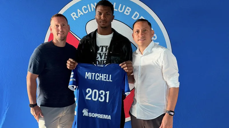 Jeyland Mitchell signing a contract with Strasbourg officials and his agents.