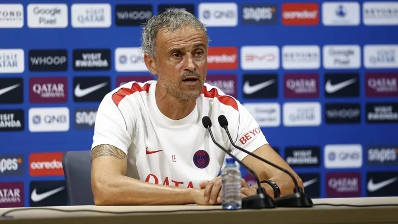 Luis Enrique: Players Without a Smile Should Look for Another Solution Luis Enrique speaking at a press conference, emphasizing the need for player happiness.