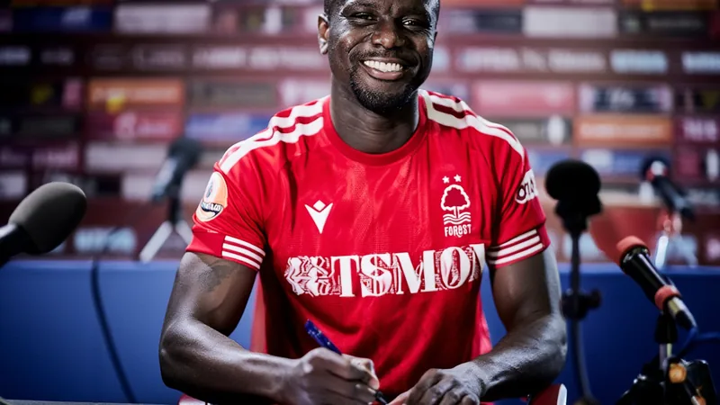 Diomande Joins Nottingham Forest for €40m Ousmane Diomande in Nottingham Forest kit, signing contract