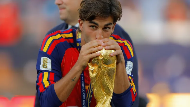 Ferran Torres in action during a football match, with PSG and Barcelona transfer speculation in the background. — latest news and analysis.