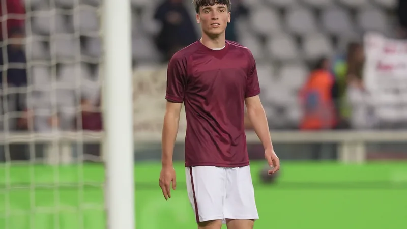 Roma to Renew Bid for Torino's Cacciamani A football transfer scene with AS Roma and Torino colors, focusing on Alessio Cacciamani.