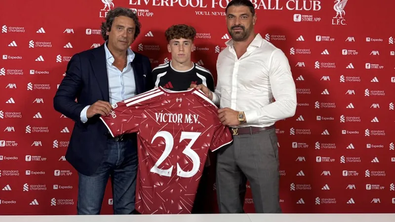 Victor Munoz poses for a photo at Liverpool's AXA Training Centre with agents Andy Bara and Juanma Lopez. — latest news and analysis.