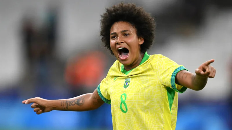 Vitoria Yaya in Brazil national team jersey, smiling during a match, with stadium lights in background. — latest news and analysis.