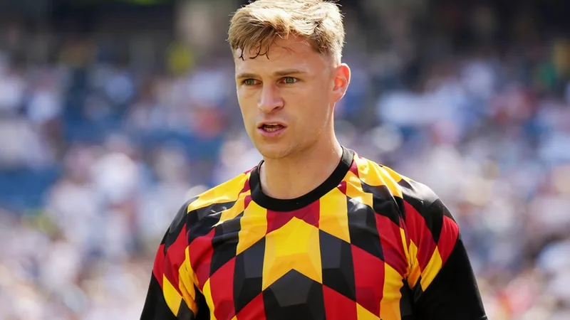 Joshua Kimmich im Trikot der deutschen Nationalmannschaft, der nach einem Spiel enttäuscht in die Kamera blickt — latest news and analysis.