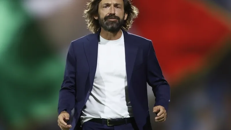 Andrea Pirlo weist politische Deutung seiner Russland-Kooperation Andrea Pirlo im Trainingsanzug auf einer Pressekonferenz, ernst blickend, mit Mikrofonen vor sich — latest news and analysis.