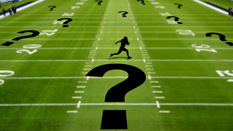 Wer bin ich? Errate den WM-Star Nr. 29 — Football World Cup News Ein Fußballspieler in Aktion auf dem Spielfeld, mit verschwommenem Hintergrund und einem Fragezeichen über dem Kopf — latest news and analysis.