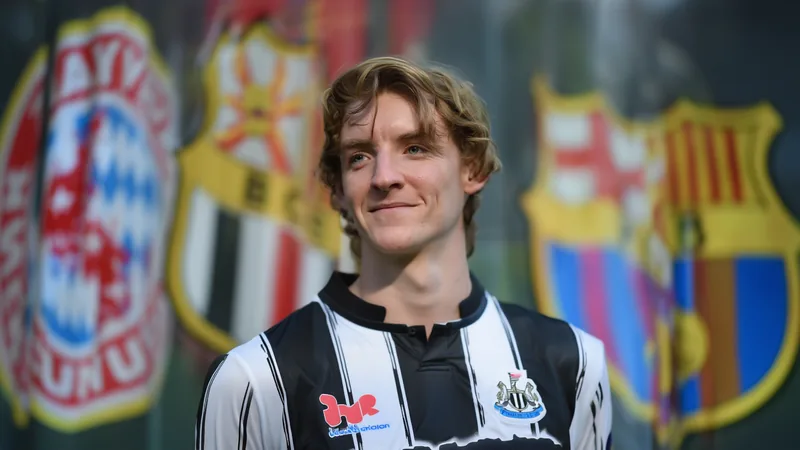 Barcelona bid €80m for Newcastle's Anthony Gordon Anthony Gordon in Newcastle United kit, with Barcelona and Bayern Munich logos in background, transfer speculation. — latest news and analysis.