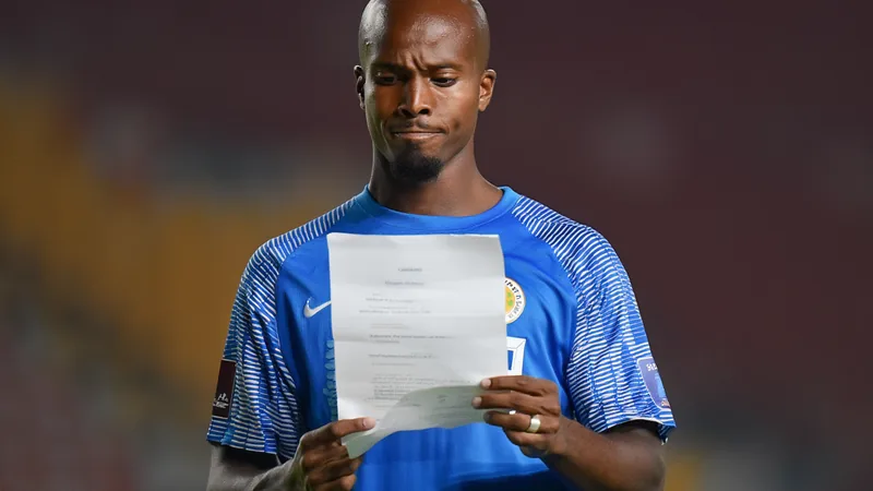 Gervane Kastaneer holding a letter from his father, emotional reaction captured on camera for FIFA's Letters that Unite series.