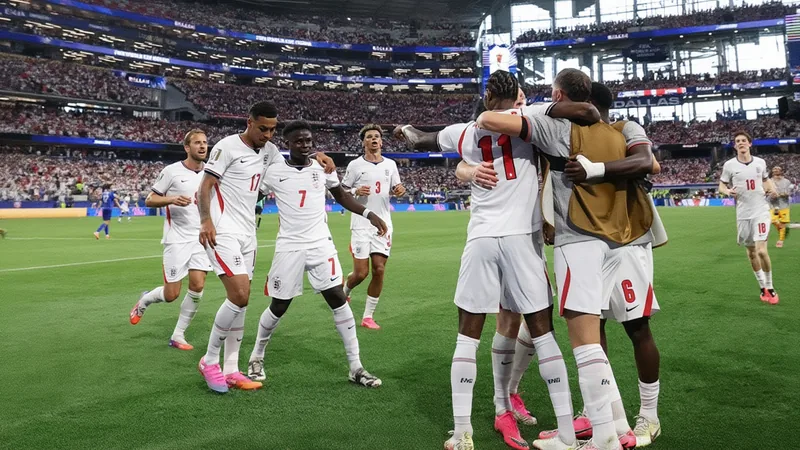 Jugadores de Inglaterra celebrando un gol en un estadio lleno, con Thomas Tuchel en la banda dirigiendo al equipo. — latest news and analysis.