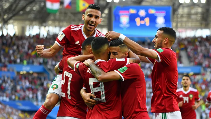 Jugadores de Marruecos celebrando un gol contra Brasil en un estadio lleno, con banderas marroquíes ondeando. — latest news and analysis.