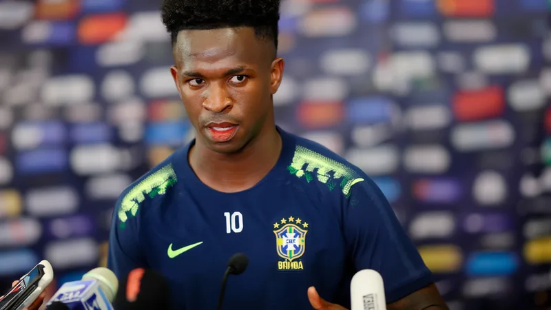 Vinícius Júnior con la camiseta de Brasil durante un partido de eliminatorias, celebrando un gol con el puño en alto. — latest news and analysis.