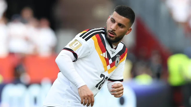 Denis Undav célébrant un but avec ses coéquipiers allemands devant un stade bondé lors de la Coupe du Monde 2026 — latest news and analysis.